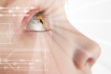 Iris scan, biometric scanning of eye retina for identification. Close-up of child pupil with high-tech graphic overlay